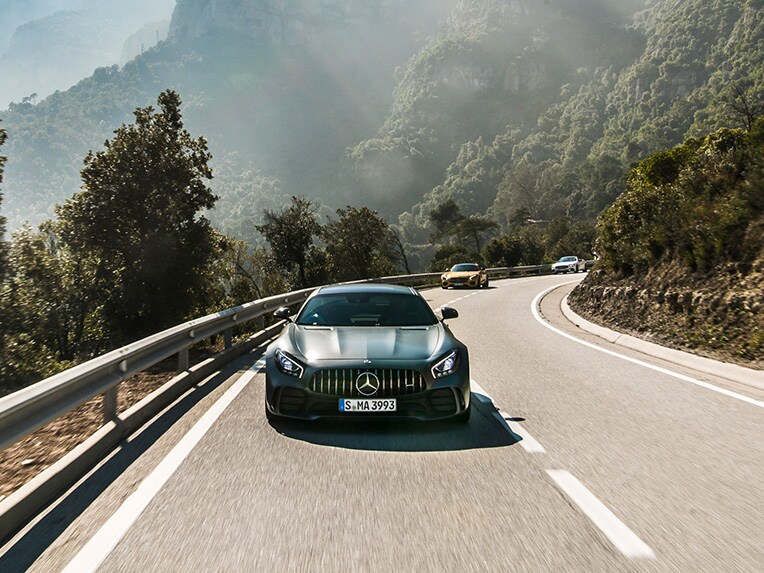 Frontal view of a Mercedes-AMG GT R out and about on the road.
