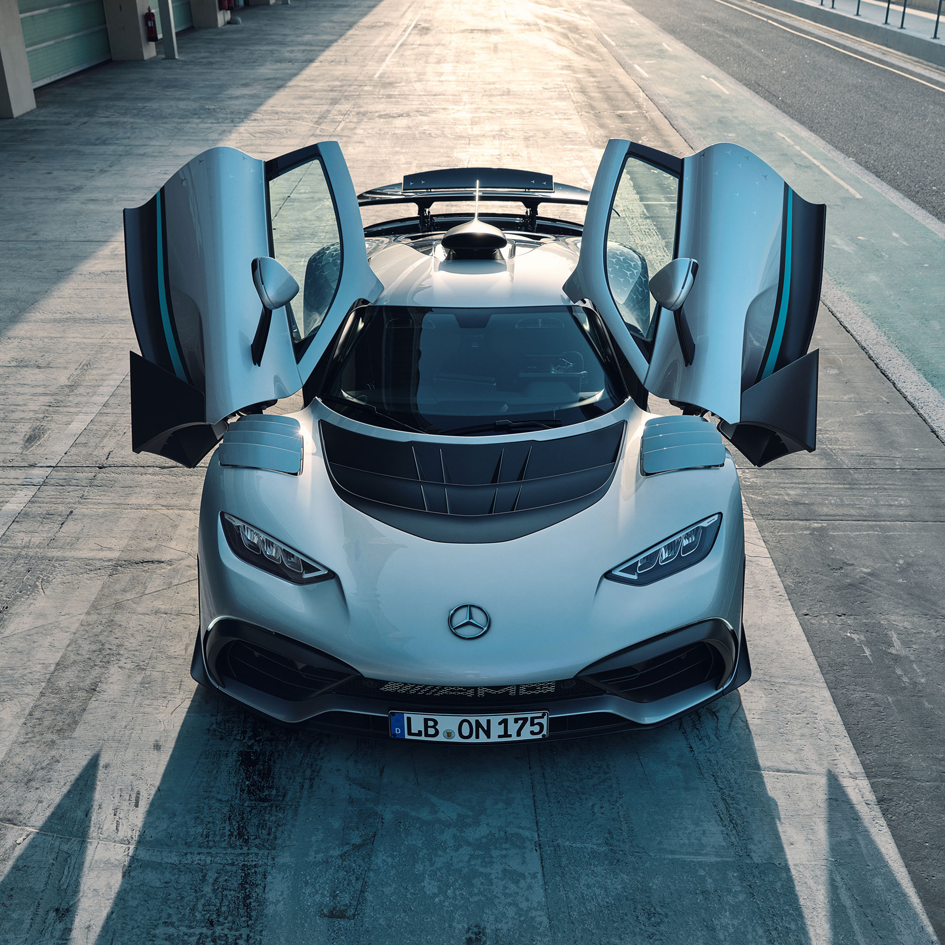 Exterior | ONE | Mercedes-AMG Front view of the Mercedes-AMG ONE with the doors open.