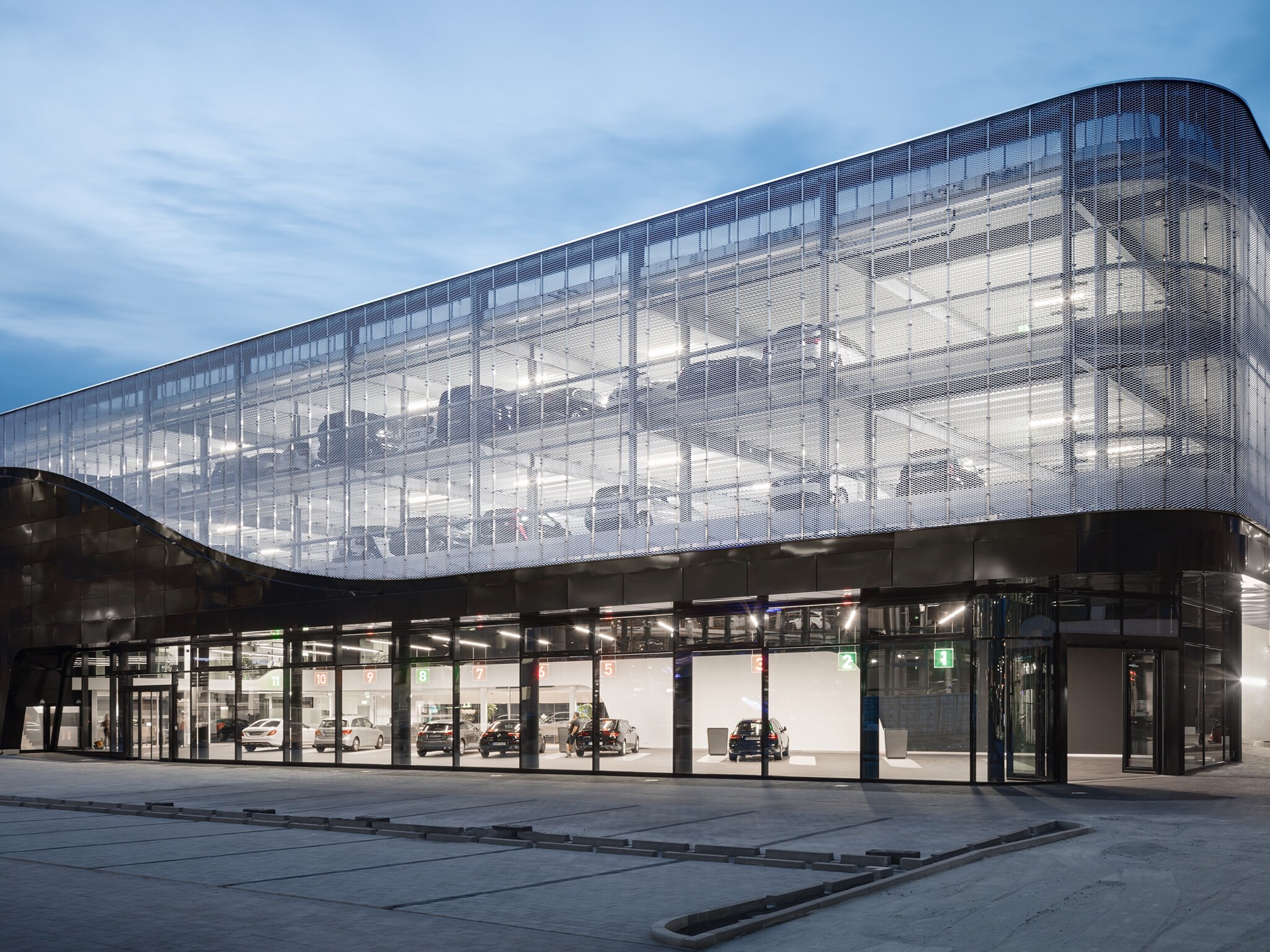 The image shows a service terminal of the Mercedes World in Berlin from the front.