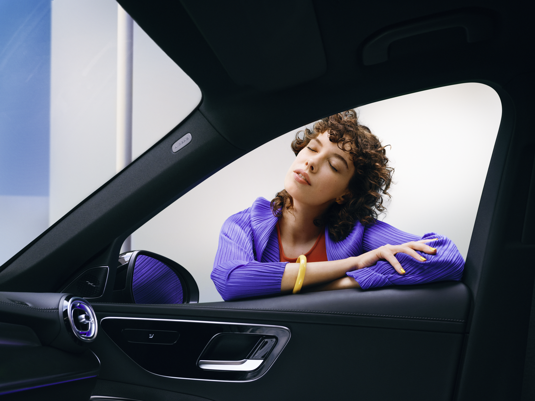 Mercedes-Benz | Genuine Car Care Products A woman enjoying looking at her clean Mercedes-Benz.