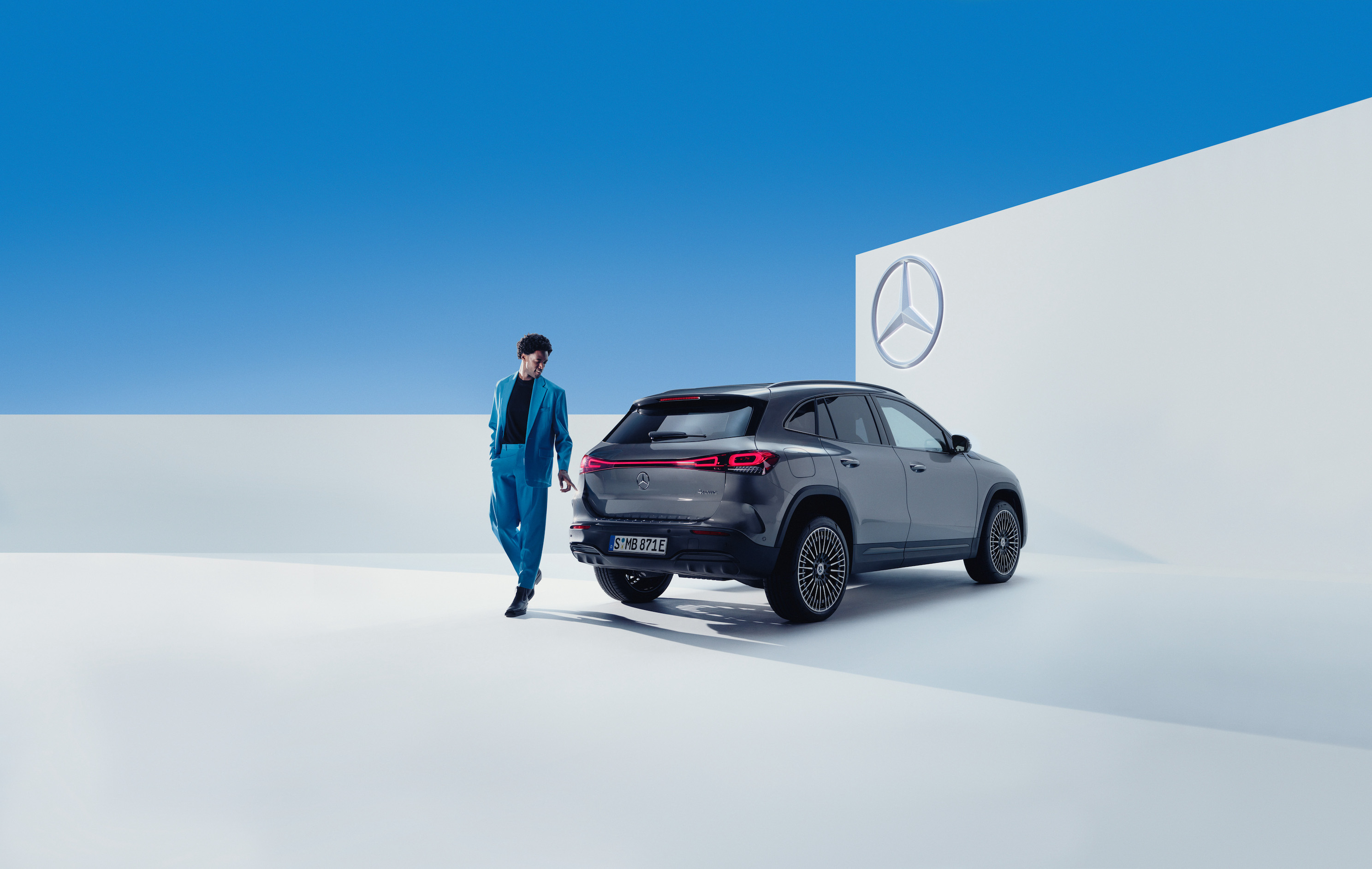 Mercedes-Benz | Genuine Car Care Products A man walks alongside his Mercedes-Benz.