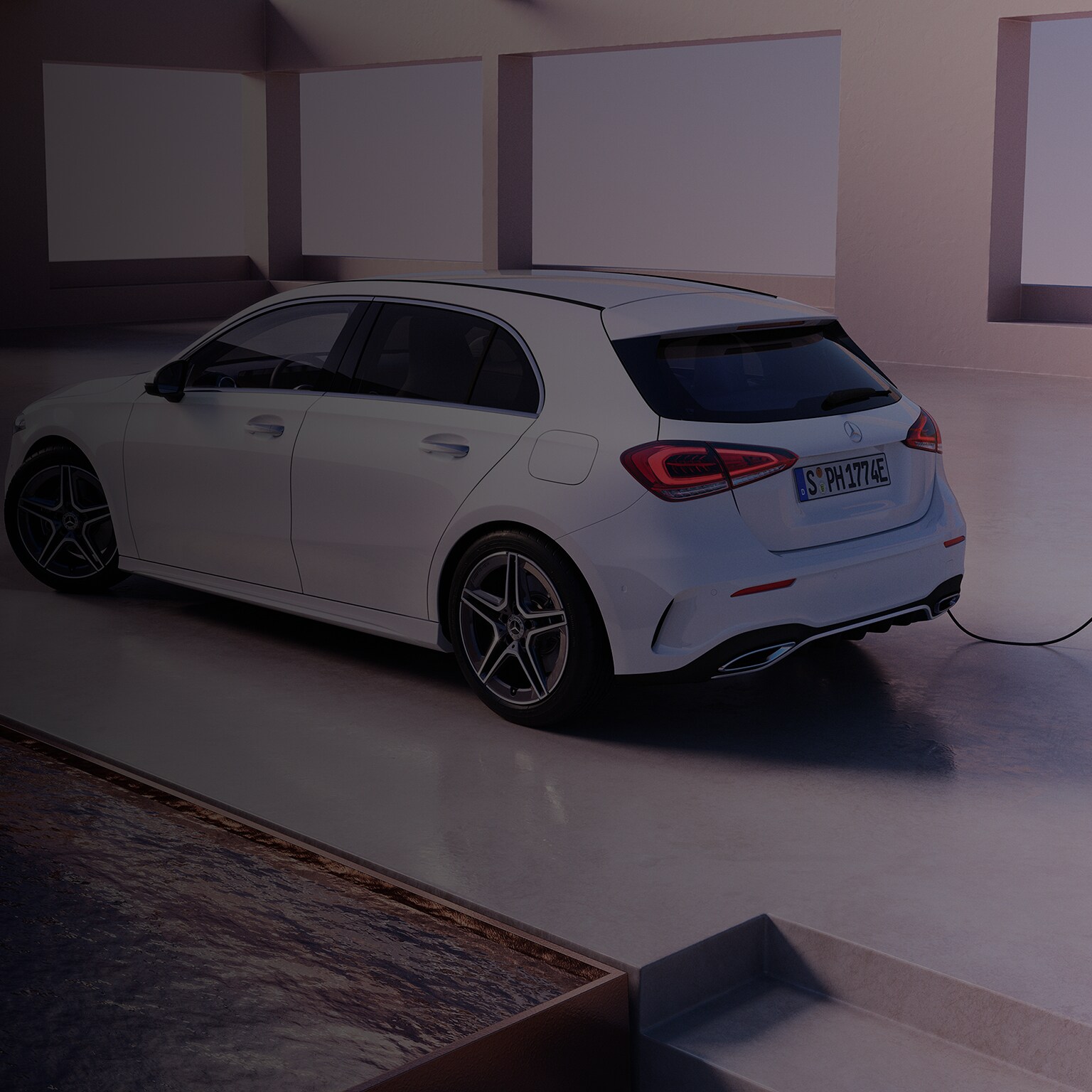 A Mercedes-Benz A-Class plug-in hybrid charging at a charging station